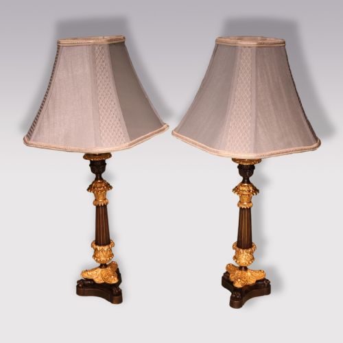 ANTIQUE PAIR OF BRONZE AND ORMOLU CANDLESTICK LAMPS