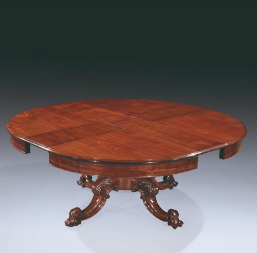 19TH CENTURY CIRCULAR MAHOGANY EXTENDING DINING TABLE WITH WINDOUT MECHANISM - ADDITIONAL PHOTO 1