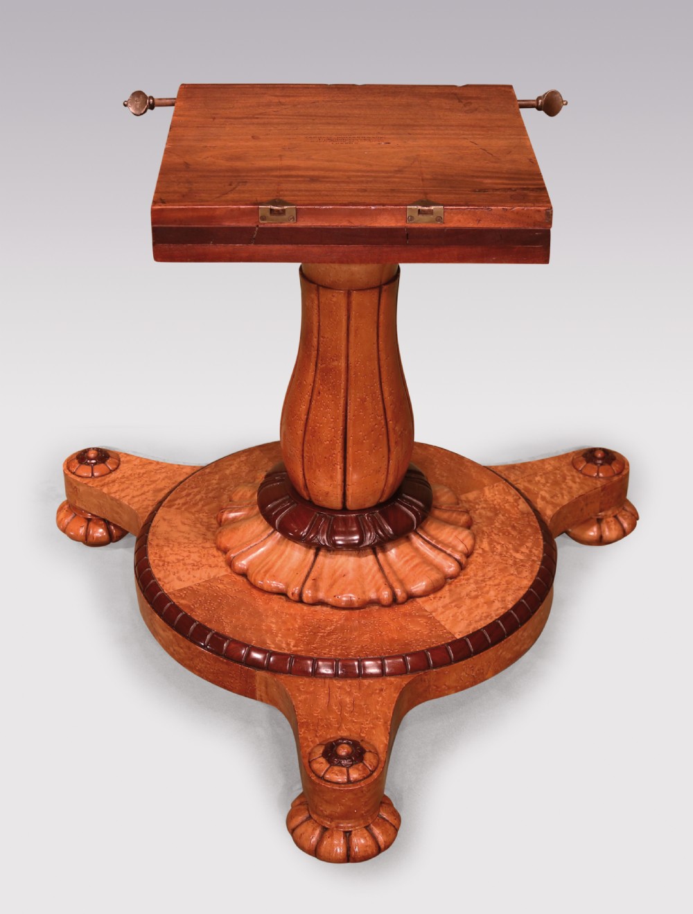A circular mid-19th-century centre table crafted from birdseye maple featuring an inlaid decorative border, a carved baluster pedestal, and a platform base on carved feet. View V