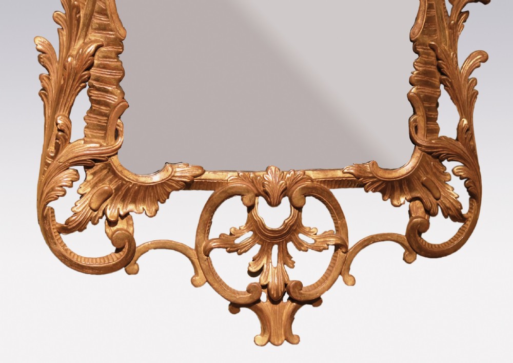 A mid-18th-century Chippendale period gilded wall mirror featuring intricate pierced Rococo scrollwork, carved acanthus leaves, and a central reflective glass panel. View III