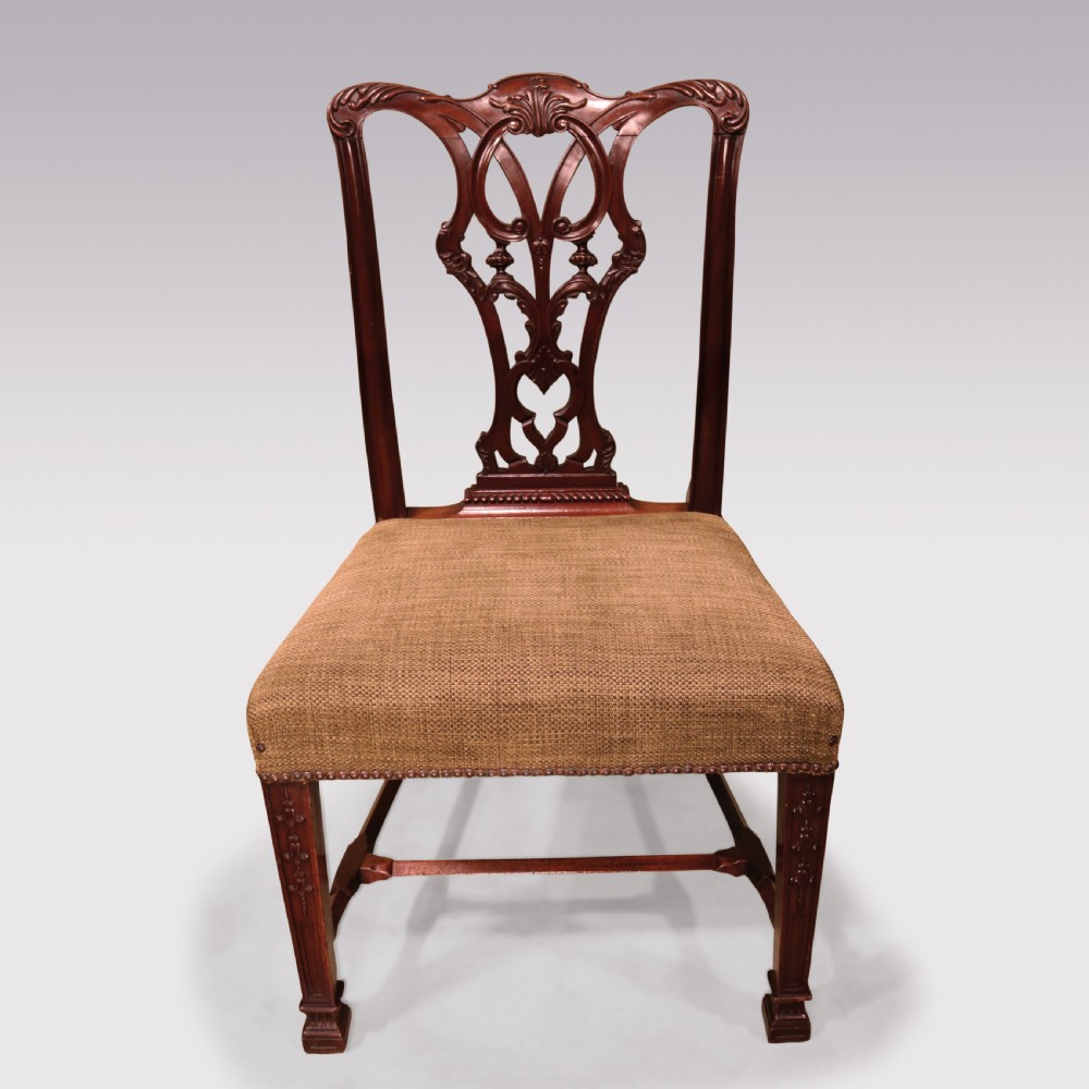 A set of six 19th-century Chippendale style mahogany single dining chairs featuring intricate pierced splats and textured woven seats. View III