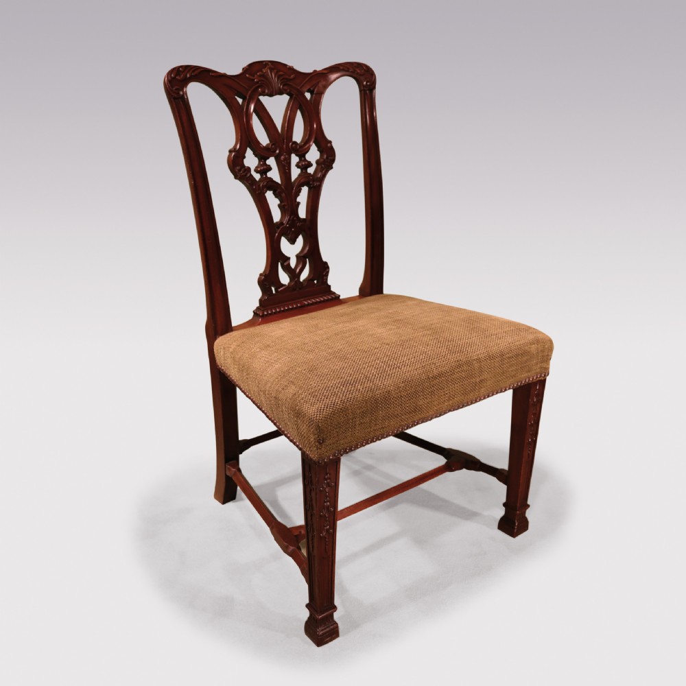 A set of six 19th-century Chippendale style mahogany single dining chairs featuring intricate pierced splats and textured woven seats. View IV