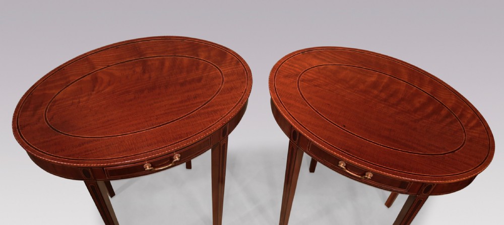 A pair of late 18th-century mahogany oval occasional tables featuring satinwood stringing, single frieze drawers with brass handles, and square tapered legs. View III