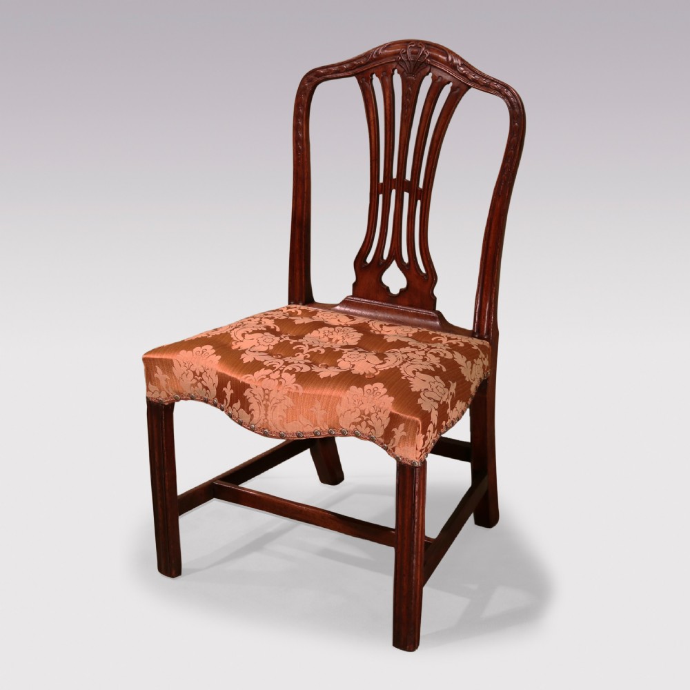A pair of 18th-century Hepplewhite mahogany side chairs featuring pierced splat backs, serpentine seats upholstered in patterned terracotta damask, and square legs with H-stretchers. View II