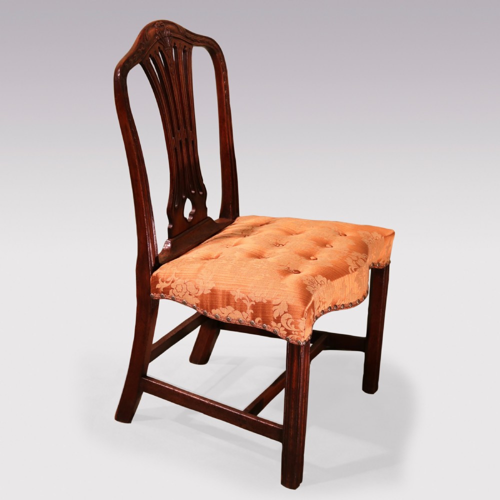 A pair of 18th-century Hepplewhite mahogany side chairs featuring pierced splat backs, serpentine seats upholstered in patterned terracotta damask, and square legs with H-stretchers. View III
