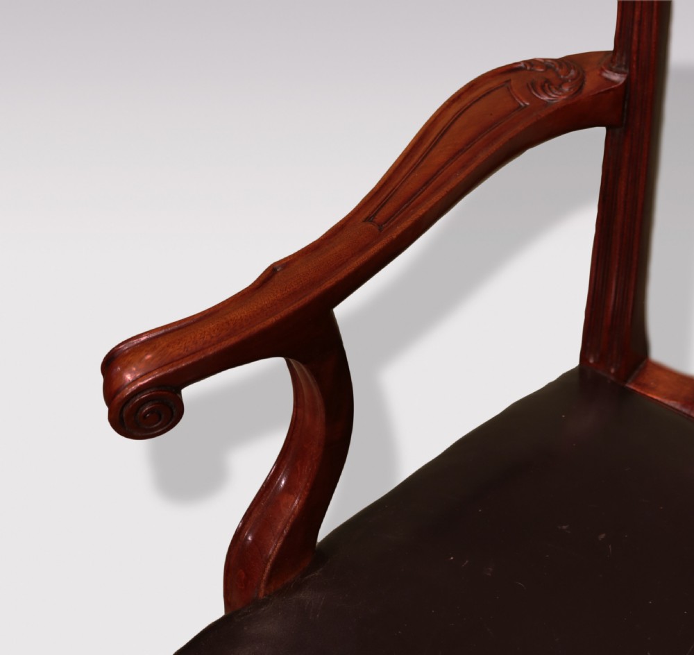 A set of eight mahogany dining chairs comprising six side chairs and two carvers with intricate pierced back splats, dark leather seats, and carved cabriole legs ending in ball and claw feet. View VII