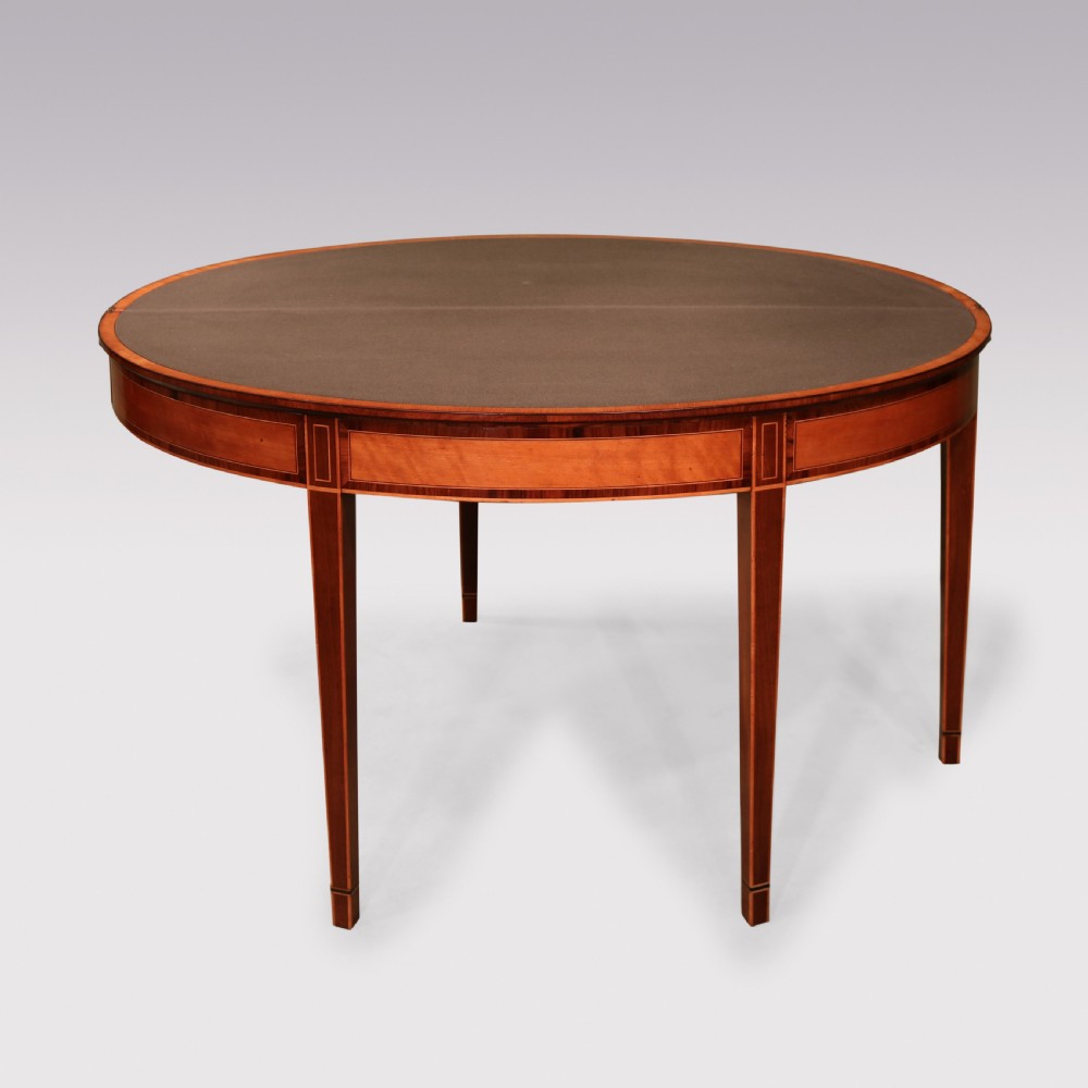 A demilune mahogany card table with satinwood crossbanding inlay and tapered square legs. View II