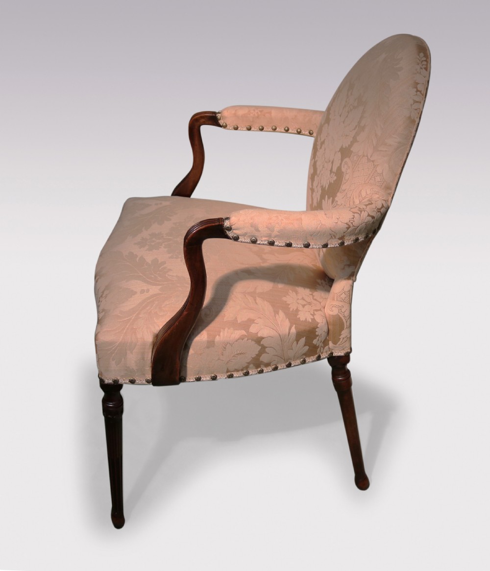 A pair of 18th-century mahogany armchairs upholstered in cream floral damask fabric with oval backrests and fluted legs. View II