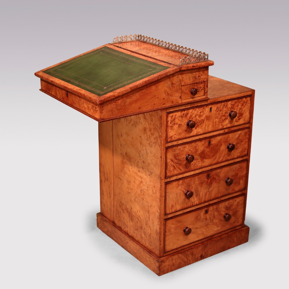 A mid 19th century burr elm Davenport desk featuring a green leather writing slope, brass gallery rail, and four stacked drawers. View III