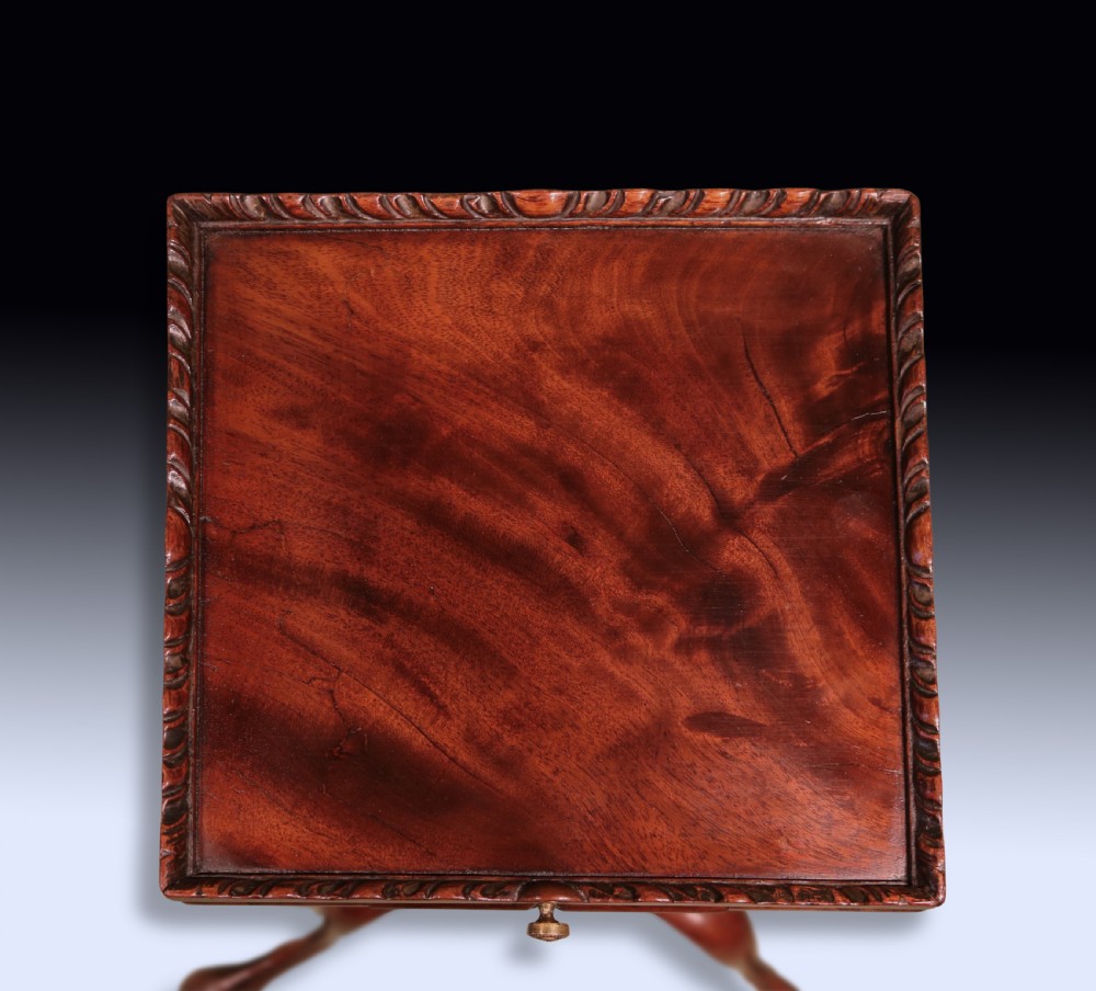 An antique George III mahogany kettle stand featuring a square tray top with a gallery rim, a pull-out slide, a spiral-carved column, and a tripod base. View III