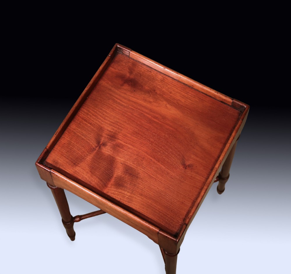 A tall George III mahogany urn stand featuring a square galleried top, slender turned legs, and a central X-stretcher. View II