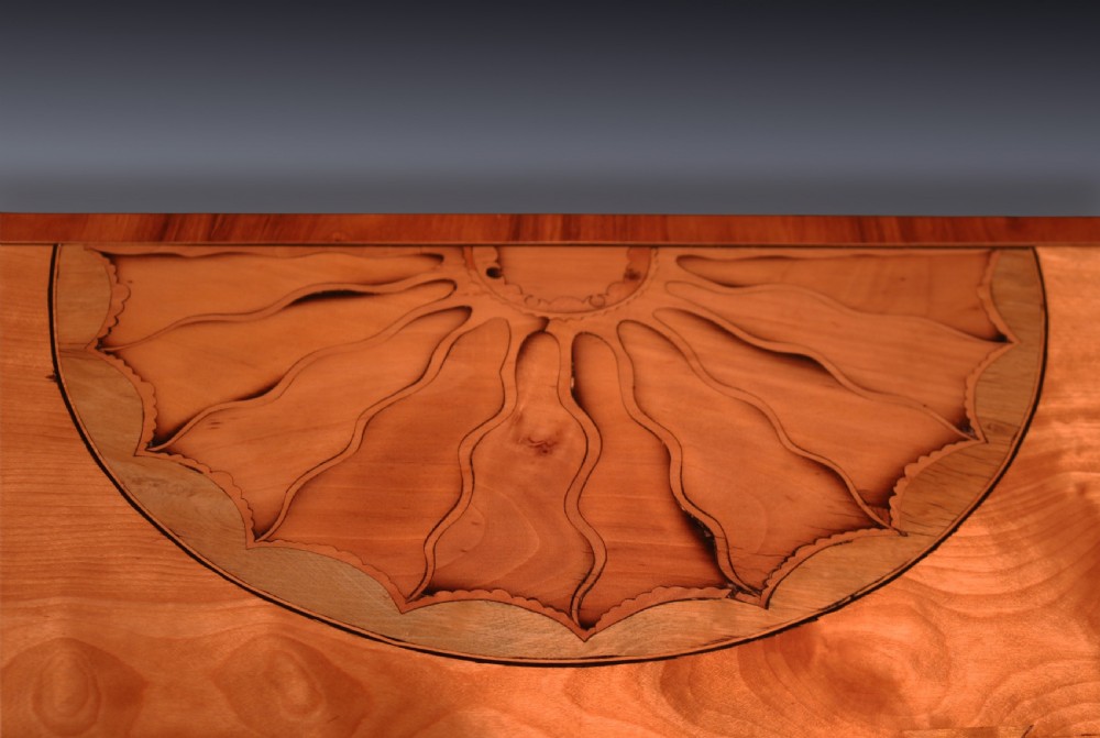 A pair of demilune antique satinwood card tables featuring central fan marquetry inlays and slender tapered legs. View VII