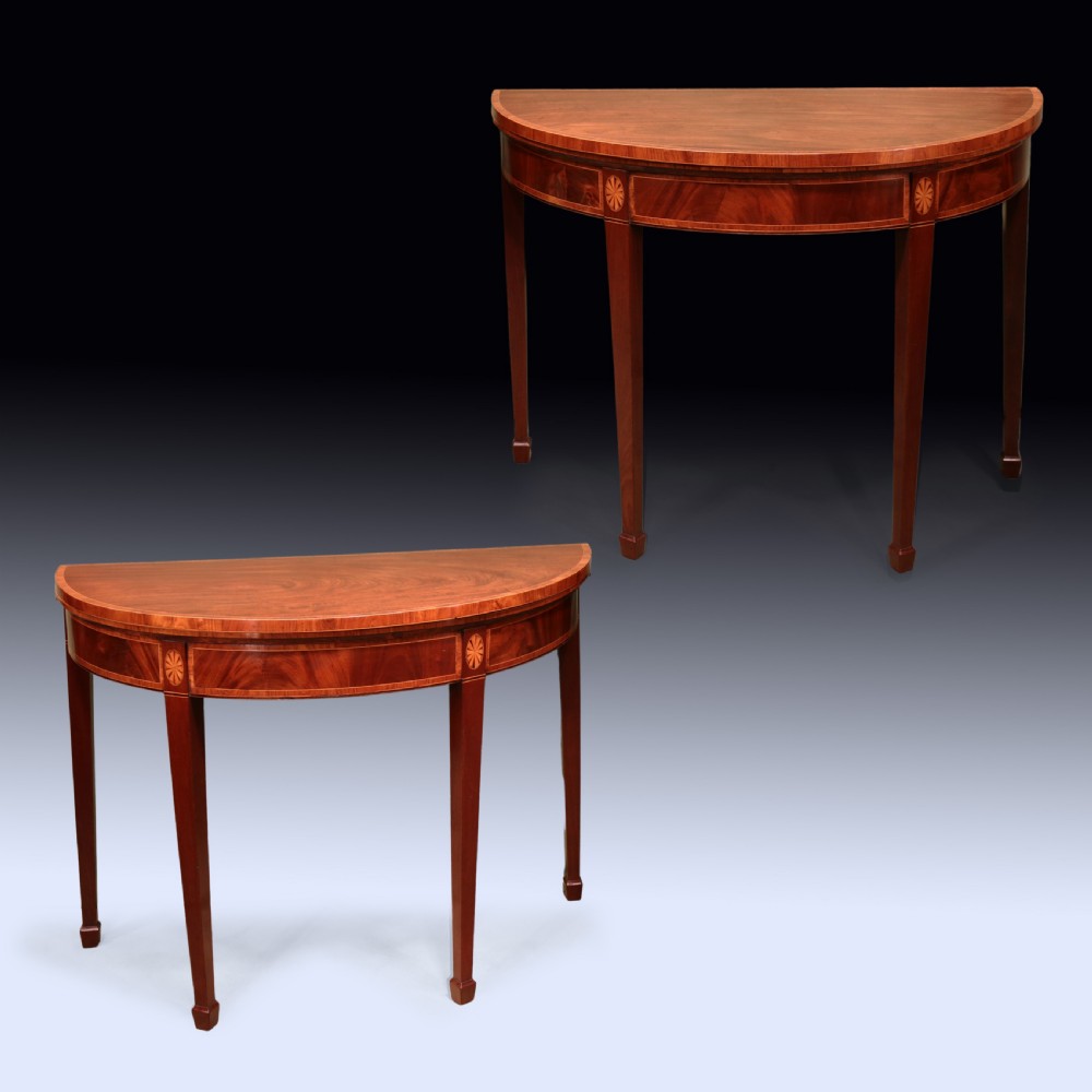 A pair of late 18th-century semi-circular mahogany card tables featuring inlaid rosettes and square tapered legs. View II