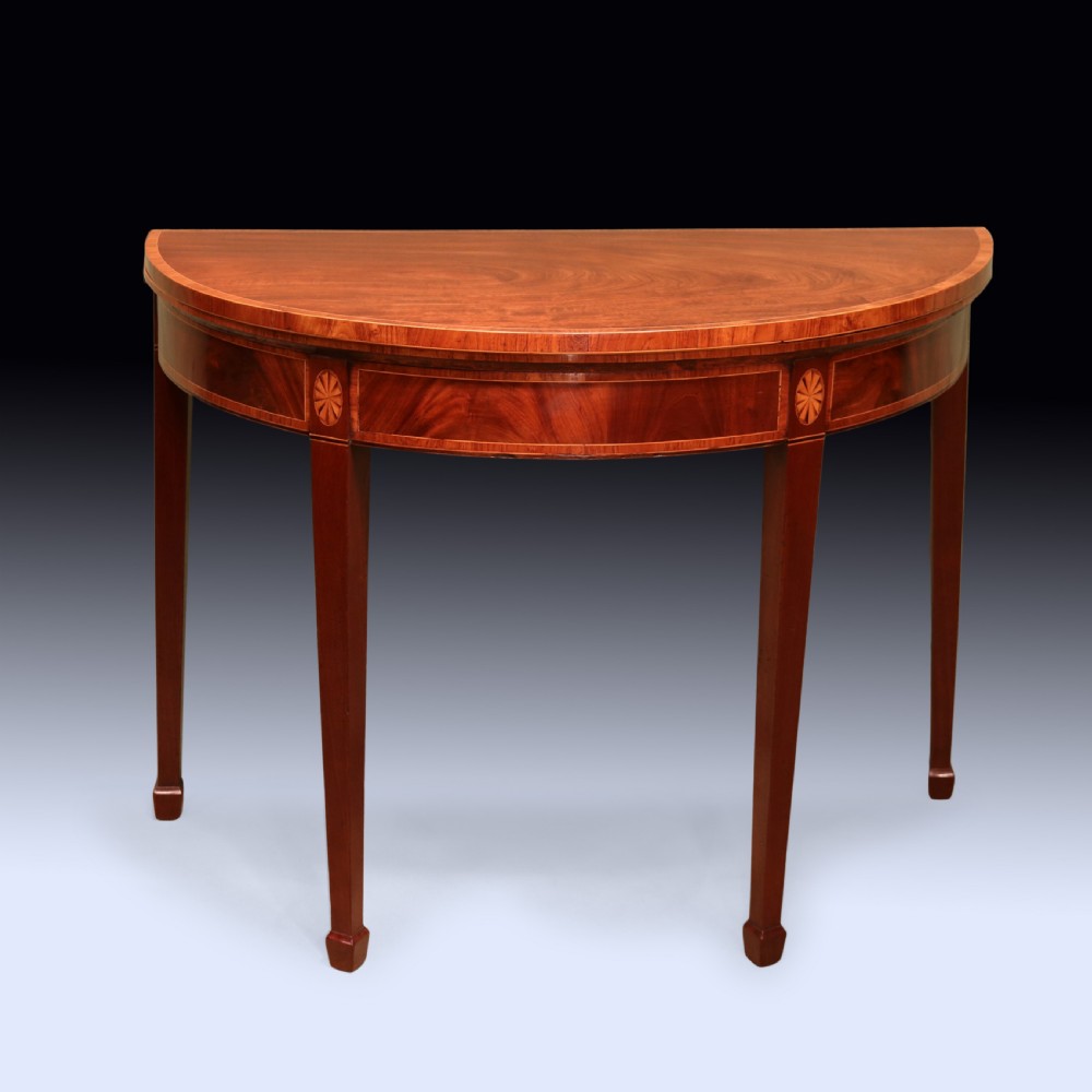 A pair of late 18th-century semi-circular mahogany card tables featuring inlaid rosettes and square tapered legs. View III