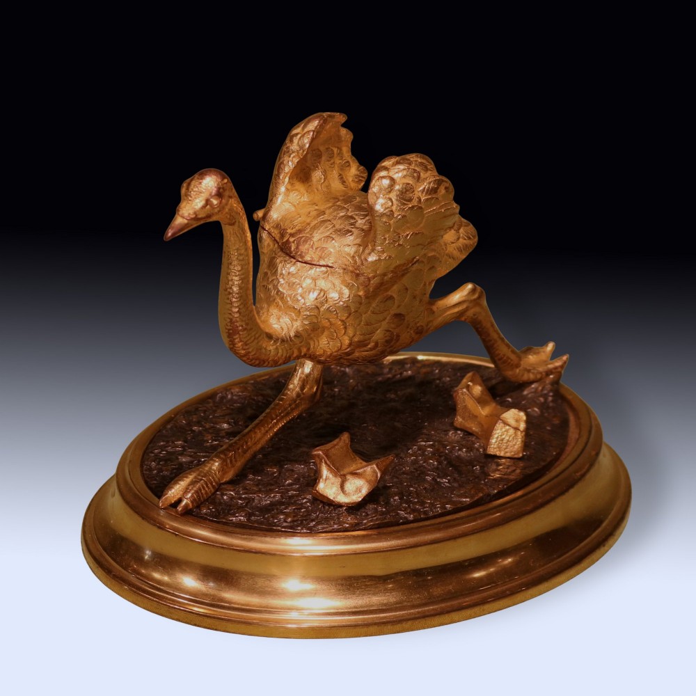A 19th-century ormolu and patinated bronze inkwell shaped as a striding emu on an oval base. View III