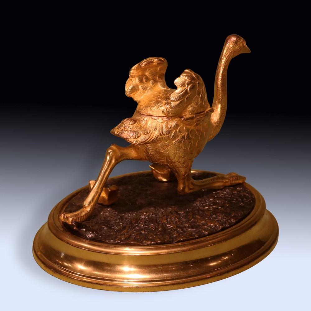 A 19th-century ormolu and patinated bronze inkwell shaped as a striding emu on an oval base. View IV