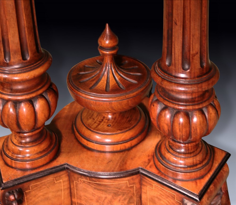 A circular mid 19th-century burr walnut centre table featuring central marquetry inlay and a carved pedestal base with splayed legs. View VII