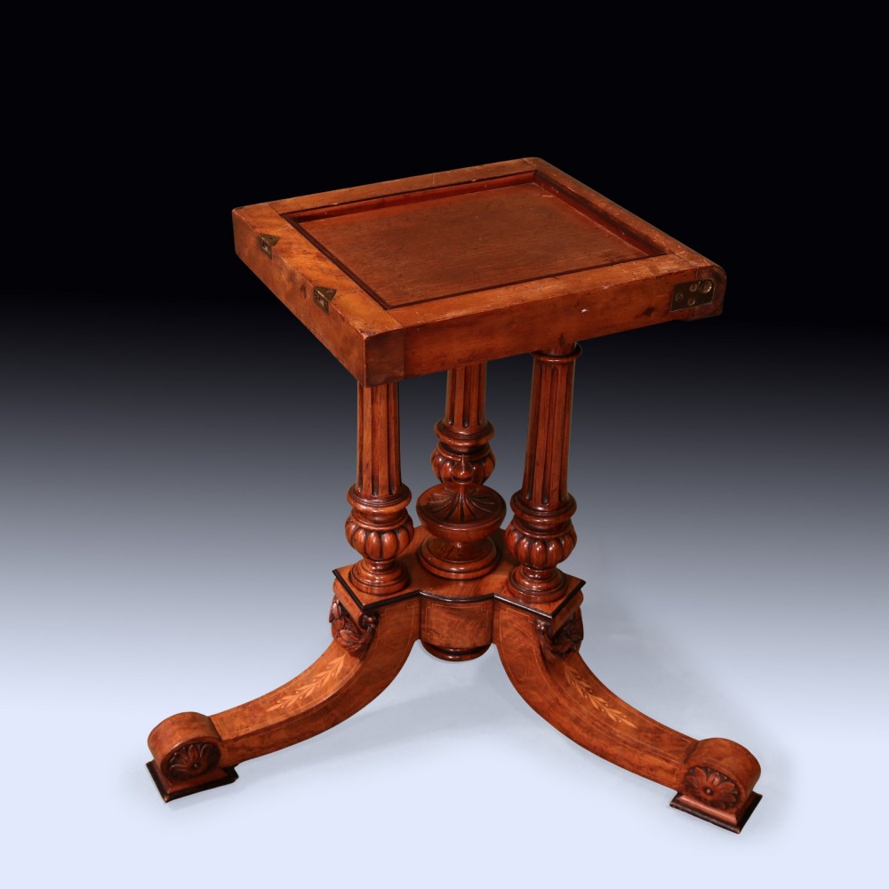 A circular mid 19th-century burr walnut centre table featuring central marquetry inlay and a carved pedestal base with splayed legs. View VIII