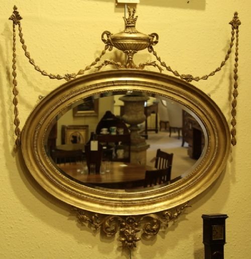 An Edwardian Oval Carved Gilded Wall Mirror with Original Mercury Glass Circa 1900
