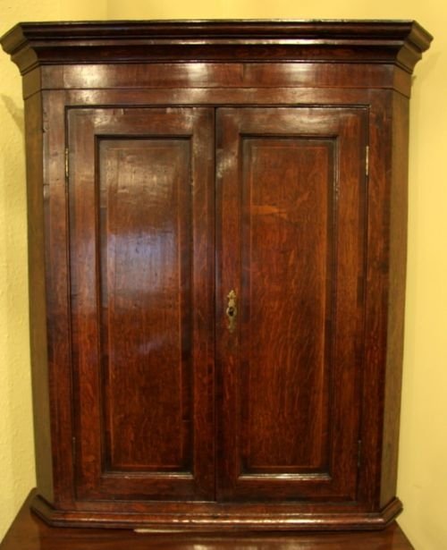 A George III Two Door Oak Hanging Corner Cupboard