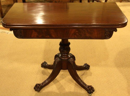 A Regency Mahogany Tea Table on Claw Feet