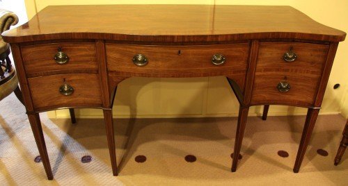 A Sheraton Period Serpentine Fronted Sideboard with Original Cellarette