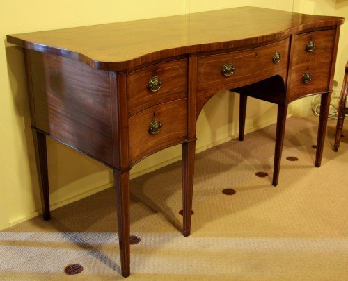 fig 1. A Sheraton Period Serpentine Fronted Sideboard with Original Cellarette