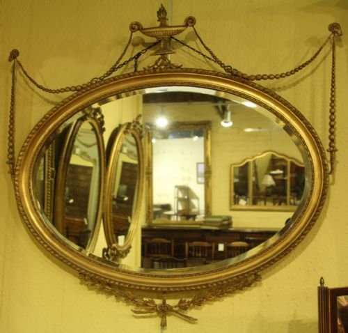 An Edwardian Adam-style Oval Gilt Mirror