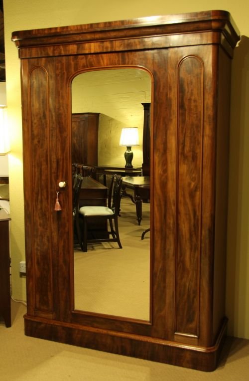 fig 1. A Victorian Mahogany Wardrobe with Mirrored Doors.