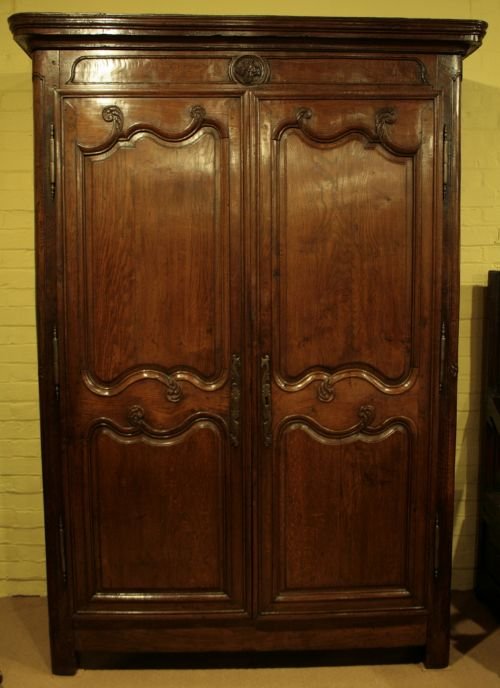 A French Provincial Oak Armoire.