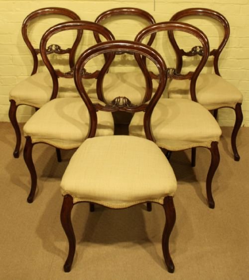 A Set of 6 Mid Victorian Walnut Balloon Back Dining Chairs