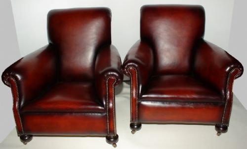 A Pair of Victorian Club Chairs Reupholstered in Hide
