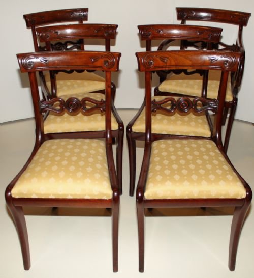 A Set of 6 Regency Mahogany Sabre-leg Dining Chairs