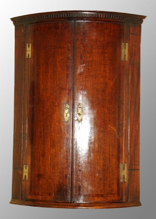 George III Oak and Mahogany Bow Front Corner Cupboard