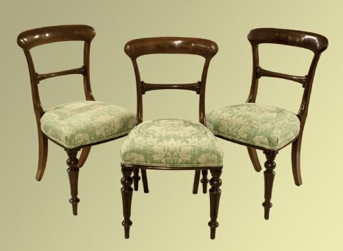 Twelve Victorian Mahogany Balloon Back Dining Chairs