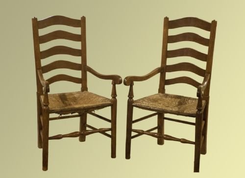 Pair of Arts and Crafts Rush-seated Oak Carver Chairs