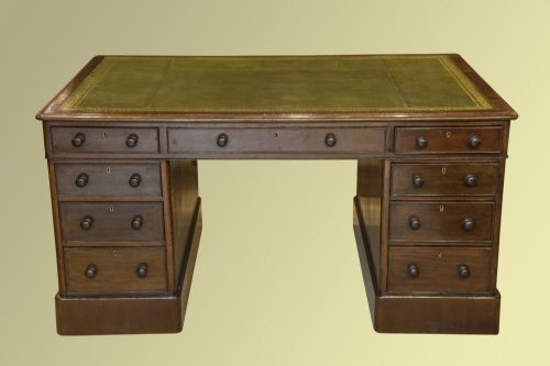 A Victorian Mahogany Partners Desk with Green Leather-lined Top