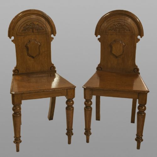 Pair of Oak Victorian Hall Chairs with Carved Leaf Detail