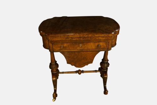 A Victorian Burr Walnut Games & Sewing Table
