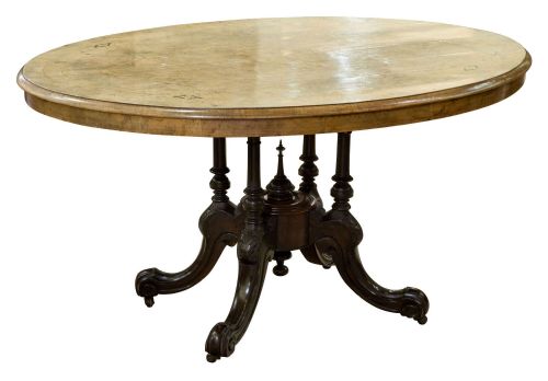 An Oval Inlaid Walnut Loo Table on Quadruple Base