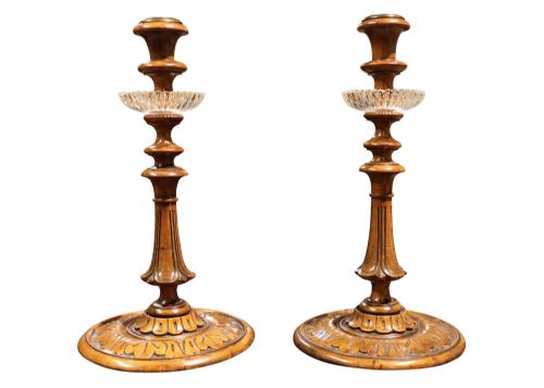 A Pair of Carved Walnut Candlesticks