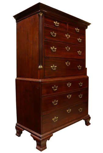 fig 1. A George II mahogany tallboy featuring a upper and lower chest of drawers with decorative brass handles and bracket feet.