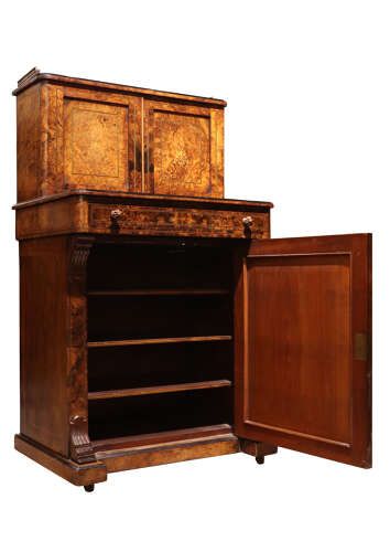 fig 1. A Victorian burr walnut bureau de dame featuring intricate brass inlay, a top cabinet with twin doors, a full-width drawer, and a lower cupboard set on castors.