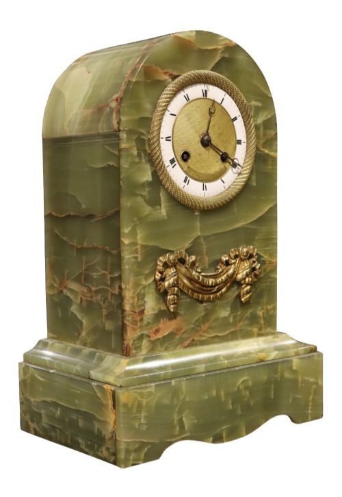 fig 1. An early nineteenth-century French mantel clock constructed from polished green onyx with an arched case, gilt-bronze ribbon swag mount, and a central dial with Roman numerals.