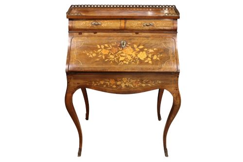 fig 2. A 19th-century French Louis XV style bonheur-du-jour writing desk featuring floral marquetry inlay, slender cabriole legs, a slant-front writing slope, and brass mounts.