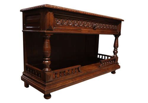 fig 2. A French Henri II style dark oak enfilade with a carved frieze drawer, turned column supports, and an open lower shelf framed by a spindle rail.