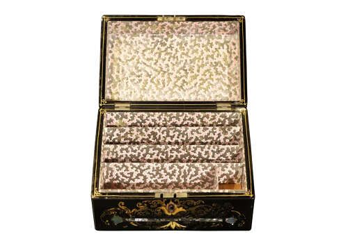 fig 1. A black lacquered Victorian sloped stationery box adorned with gold leaf scrollwork and mother-of-pearl inlay.