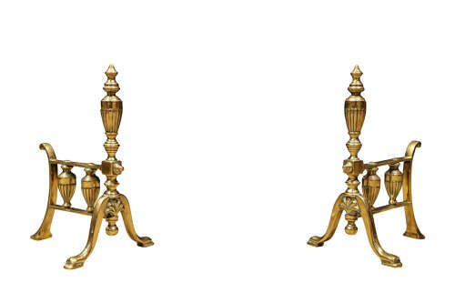 fig 1. A set of early 20th-century brass fireplace accessories featuring a pair of fire dogs, a shovel with a pierced blade, tongs, poker, and rest.