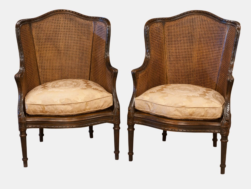 Pair of French Carved Bergere Armchairs