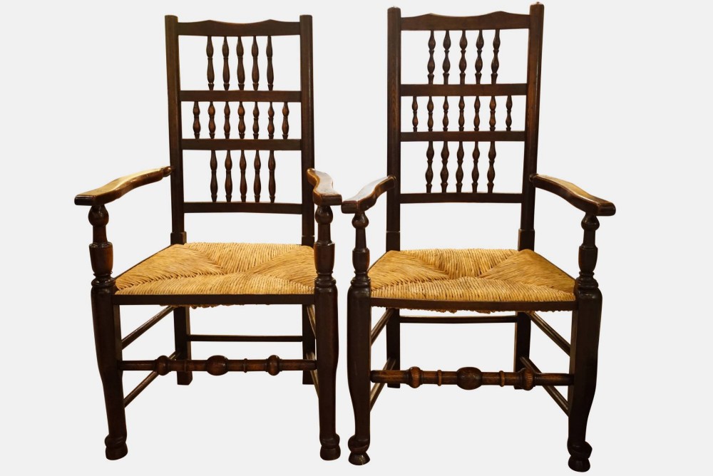 A Pair of Beech & Elm Spindle Back Armchairs